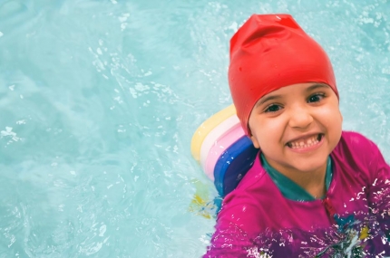 Preschooler swims during lessons at the YMCA