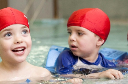 Preschoolers learn to swim at the YMCA