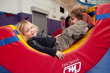 Toddlers playing in YMCA gym