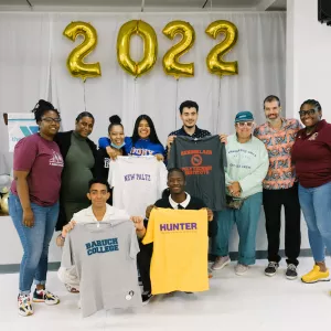 rowe scholars holding college t-shirts