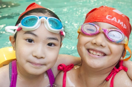 two girls swimming lesson