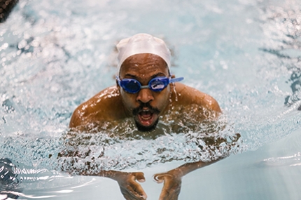 A man swimming laps in a pool