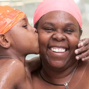 Family swimming together during rec open pool time at the YMCA