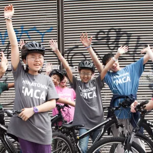 A group of kids on bikes from the Chinatown Y.