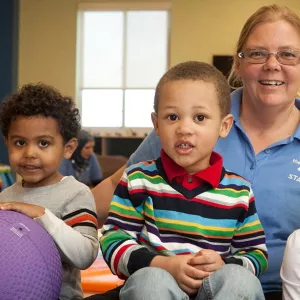 Four children and staff member in child watch room at the YMCA while you work out