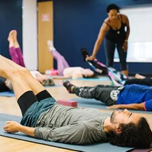 Students lying on yoga mats in Ridgewood YMCA studio