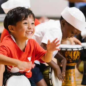 Summer camper drumming