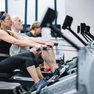 Fitness class using row machines